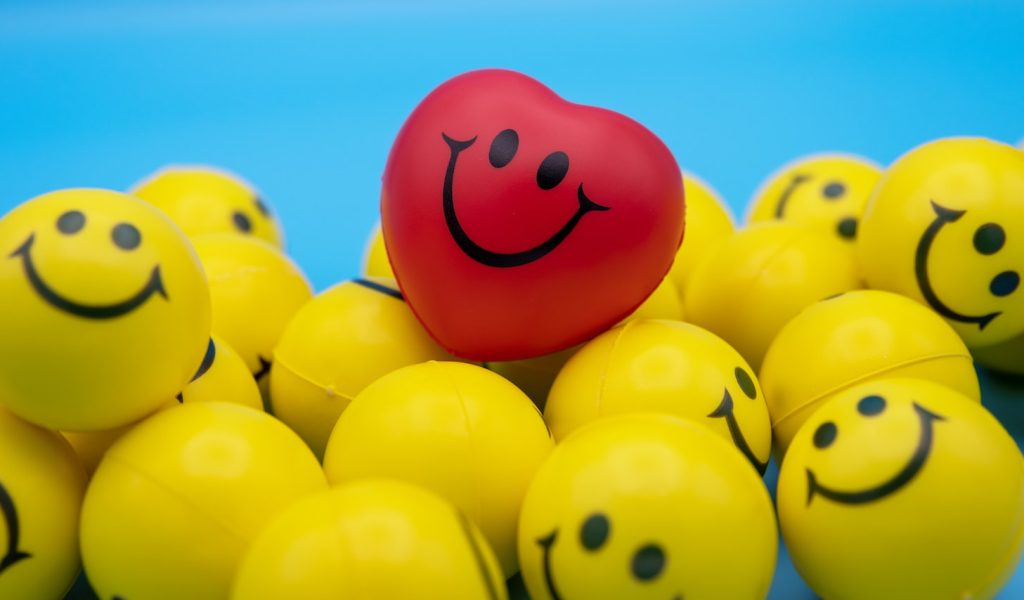 red and yellow smiley balloon